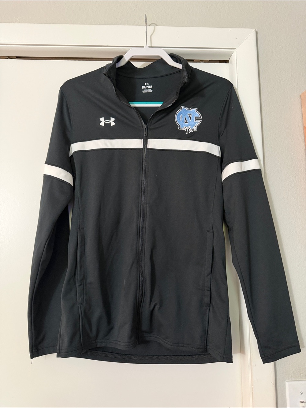 EPLC Under Armour Black Jacket with White Stripe and Light Blue NC Logo